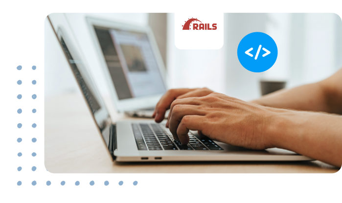 hands typing code on laptop