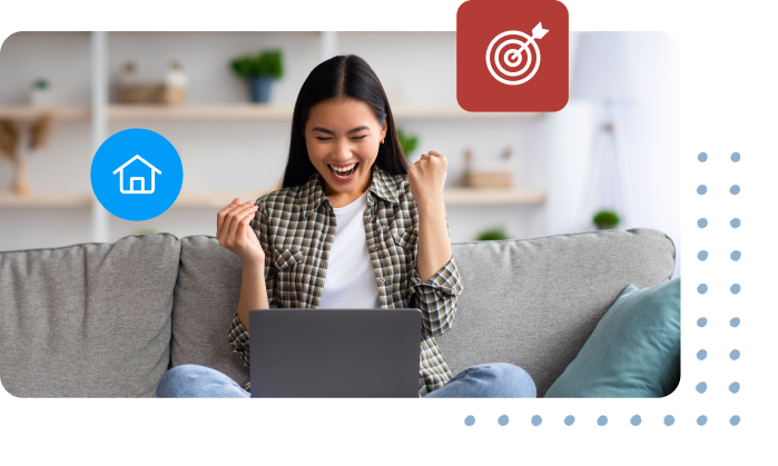 A girl celebrating while looking at her laptop